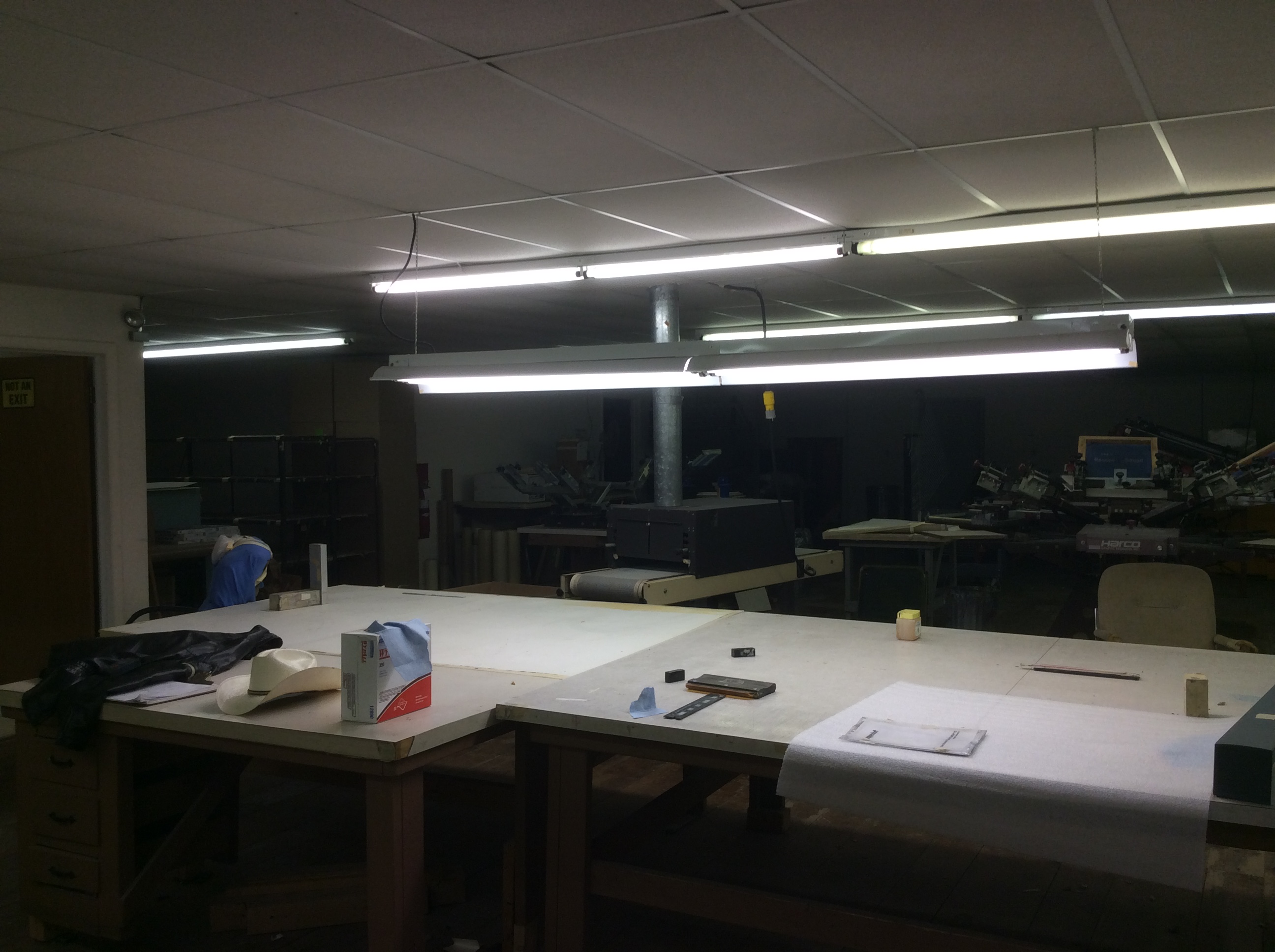Big workspace with industrial lights and project tables