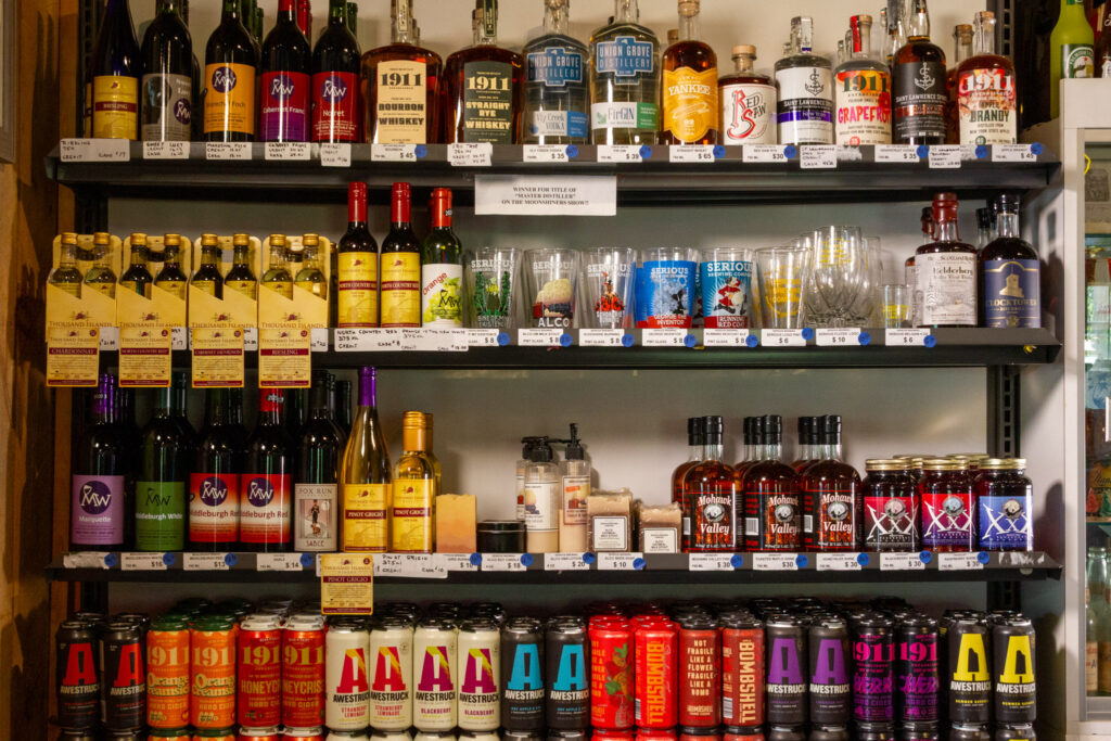 A variety of beers and spirits displayed on shelves.